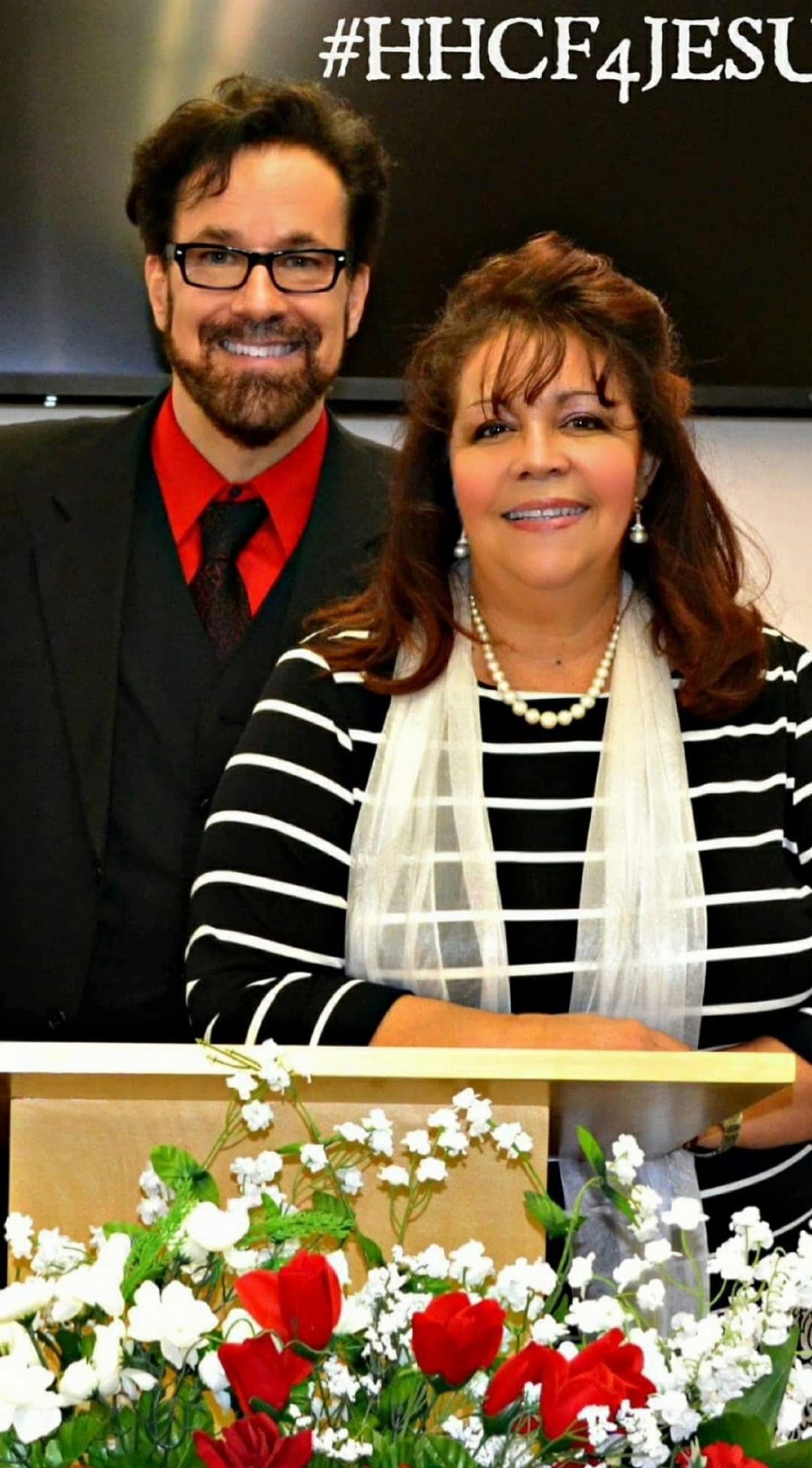 Harvest House Christian Fellowship church leaders standing at the pulpit